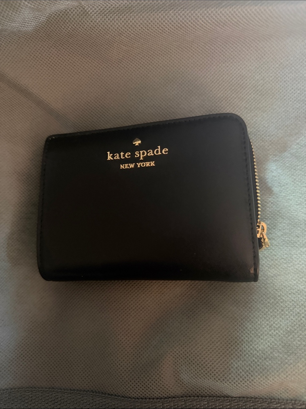 kate spade black leather compact zip wallet with gold logo